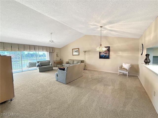 living room with carpet floors, lofted ceiling, a ceiling fan, a textured ceiling, and baseboards