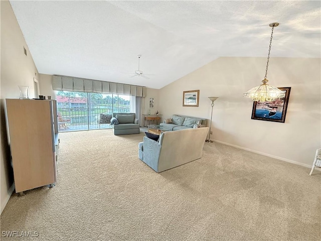 living room featuring ceiling fan, baseboards, vaulted ceiling, and carpet flooring