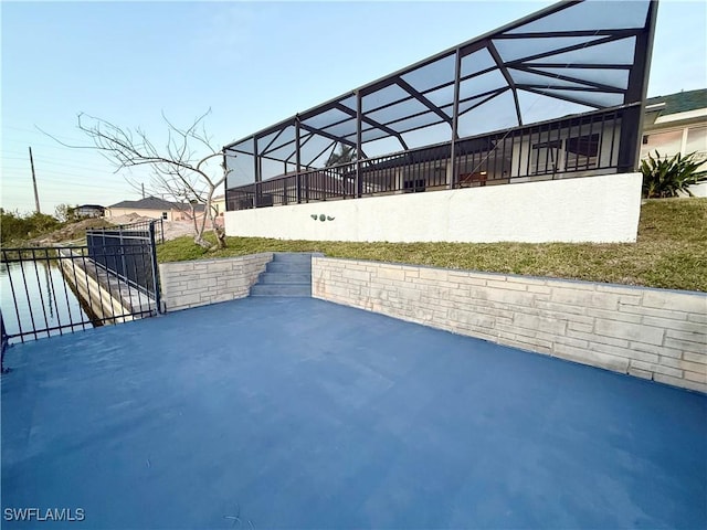 view of patio with glass enclosure