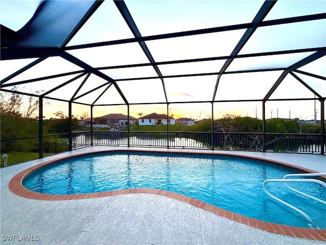 pool with a lanai and a patio