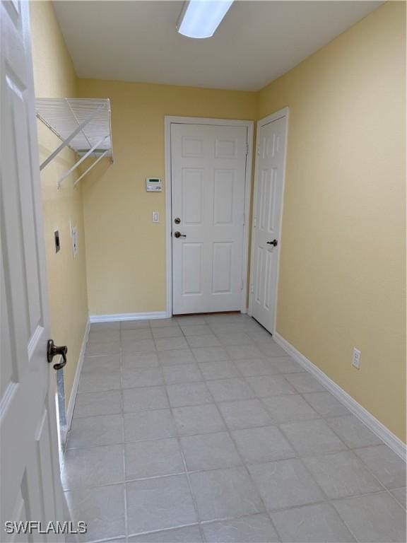 laundry room with laundry area and baseboards