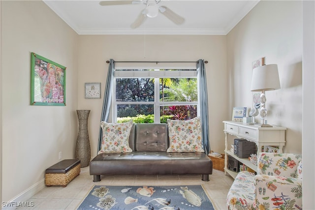 living area with baseboards, ornamental molding, a ceiling fan, and tile patterned floors