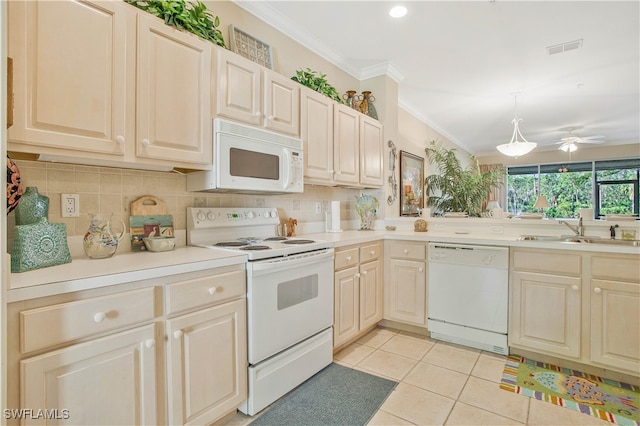 kitchen featuring crown molding, tasteful backsplash, visible vents, a sink, and white appliances