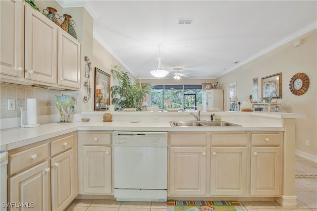 kitchen featuring visible vents, ornamental molding, white dishwasher, light brown cabinets, and a sink