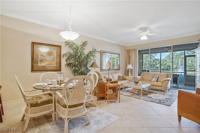 dining space featuring light tile patterned flooring, a ceiling fan, and crown molding