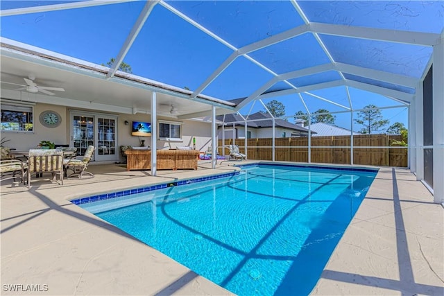 view of swimming pool with a patio, a ceiling fan, fence, a fenced in pool, and french doors