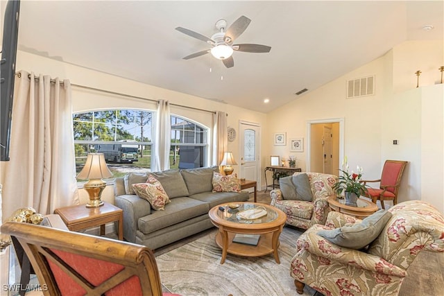 living room featuring visible vents, ceiling fan, and lofted ceiling