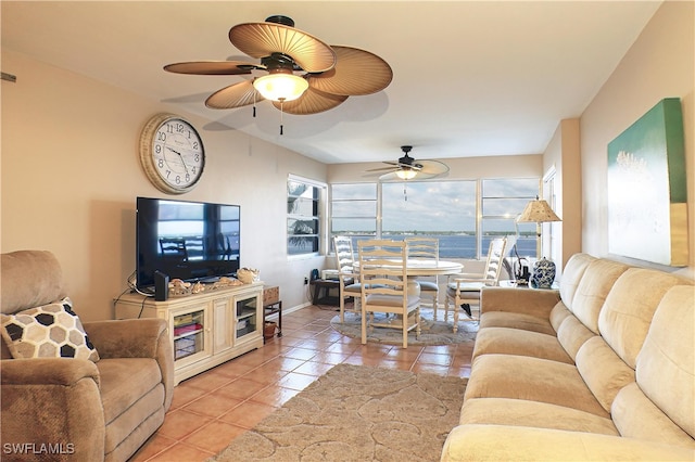 1900 Clifford St Unit 603, Fort Myers, FL 33901 - living area with light tile patterned flooring, visible vents, baseboards, and ceiling fan