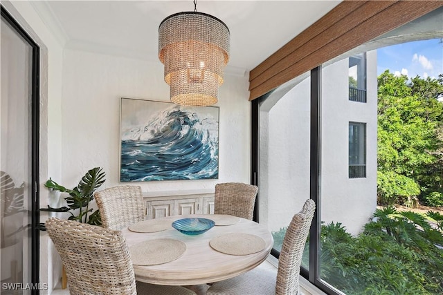 dining area featuring a notable chandelier