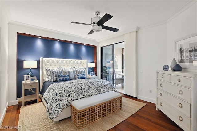 bedroom with ornamental molding, dark wood-style flooring, and baseboards