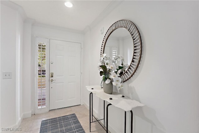 foyer featuring light tile patterned floors, recessed lighting, and baseboards