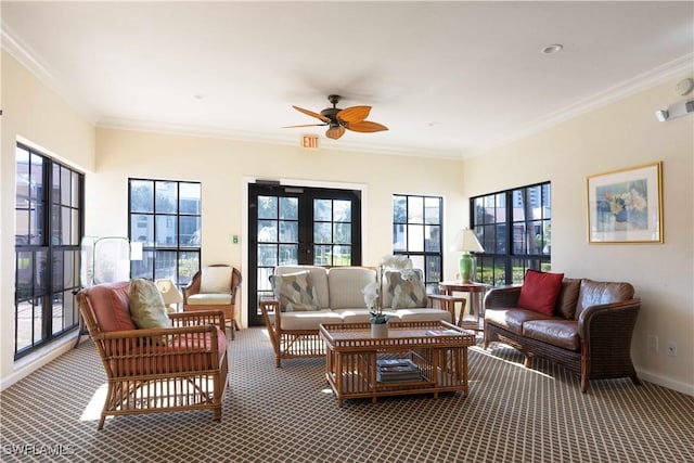 sunroom featuring a ceiling fan, a wealth of natural light, and french doors