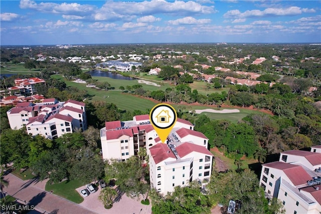 bird's eye view with a water view and golf course view