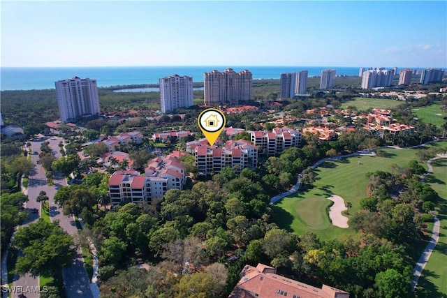 aerial view featuring golf course view and a water view