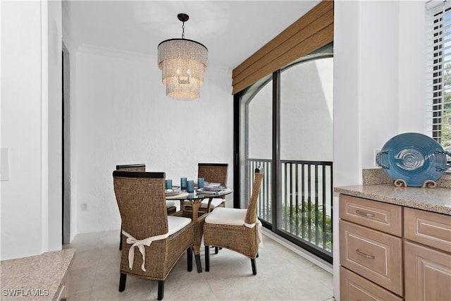 dining room featuring a notable chandelier and light tile patterned flooring