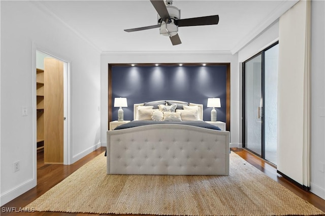 bedroom with ceiling fan, crown molding, dark wood-style floors, and baseboards