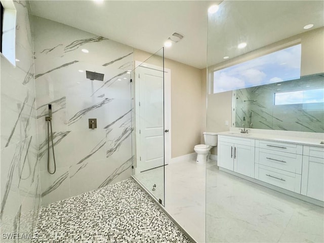 full bath featuring marble finish floor, a marble finish shower, toilet, vanity, and baseboards