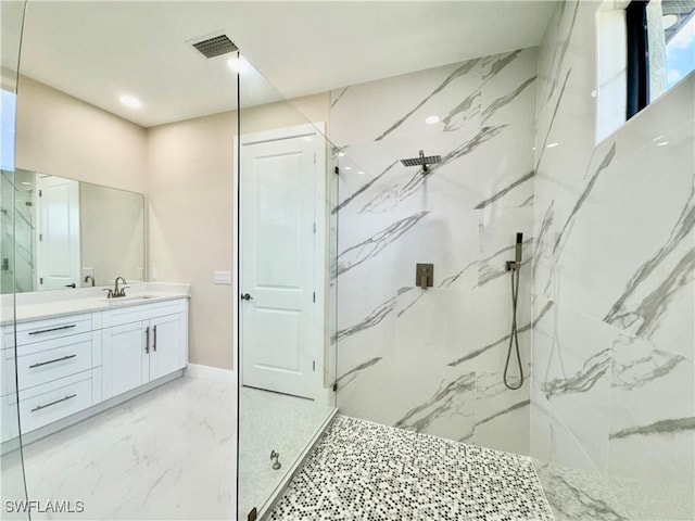 full bathroom with a marble finish shower, baseboards, visible vents, marble finish floor, and vanity