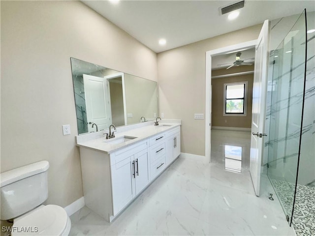 full bath with marble finish floor, a marble finish shower, a sink, and toilet