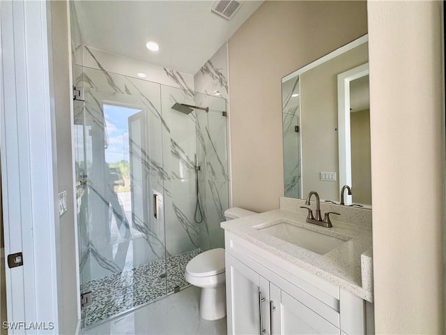 full bath with toilet, vanity, visible vents, marble finish floor, and a marble finish shower