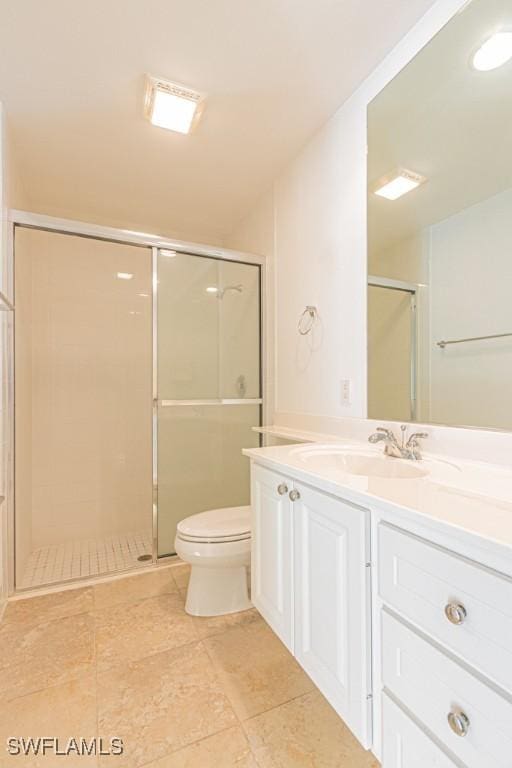 full bath with toilet, a stall shower, and vanity