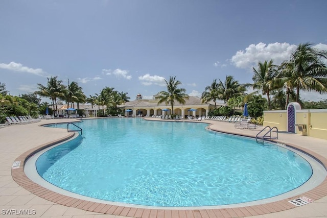 pool featuring a patio area and fence