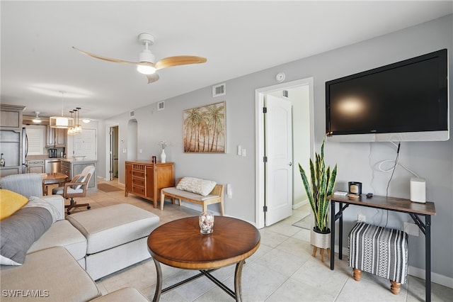 6891 Estero Blvd Unit 362, Fort Myers Beach, FL 33931 - living room with ceiling fan, light tile patterned floors, baseboards, and arched walkways