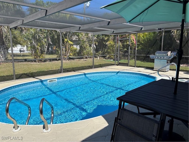 outdoor pool with glass enclosure, a grill, and a patio area