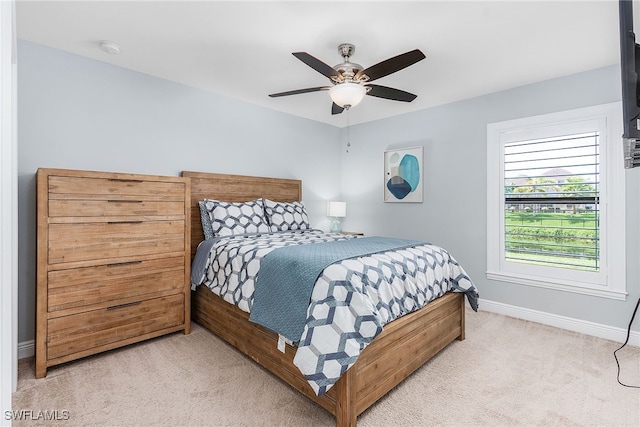 1702 SE 1st Ter, Cape Coral, FL 33990 - bedroom featuring light colored carpet, ceiling fan, and baseboards