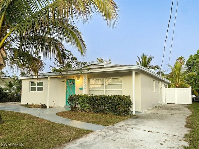 view of front of house featuring stucco siding