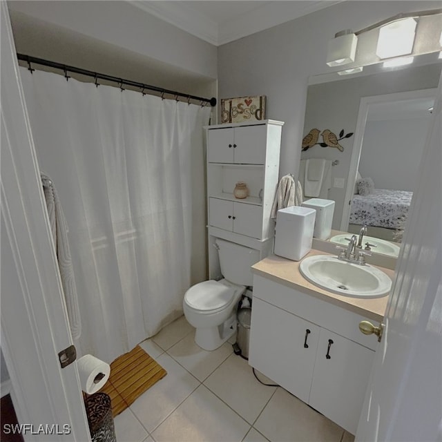 ensuite bathroom featuring ensuite bathroom, tile patterned flooring, toilet, vanity, and crown molding