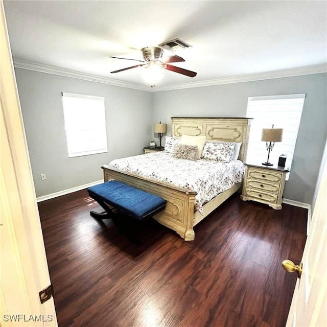 bedroom with dark wood-style floors, baseboards, visible vents, and ornamental molding