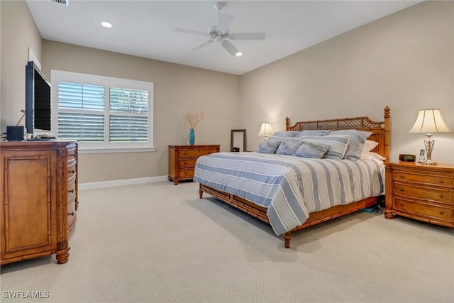 bedroom with a ceiling fan, recessed lighting, light carpet, and baseboards