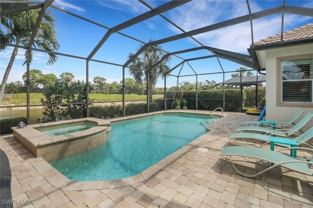 view of swimming pool with a patio area, a pool with connected hot tub, and glass enclosure