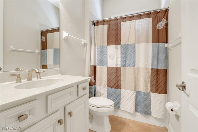 bathroom with vanity, tile patterned flooring, and toilet