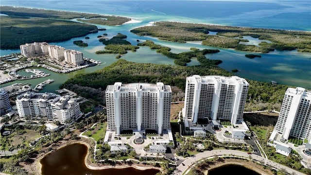 birds eye view of property featuring a water view and a city view