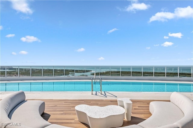 view of pool with a fenced in pool