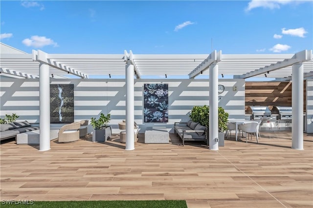 view of patio with outdoor lounge area, a grill, a deck, and a pergola