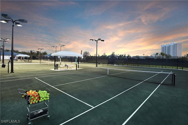 view of sport court featuring fence