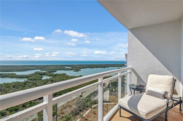 balcony featuring a water view