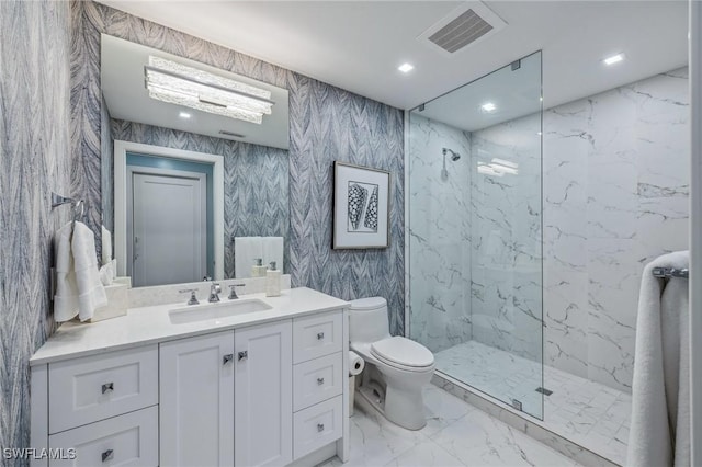 full bathroom featuring marble finish floor, a marble finish shower, visible vents, toilet, and vanity