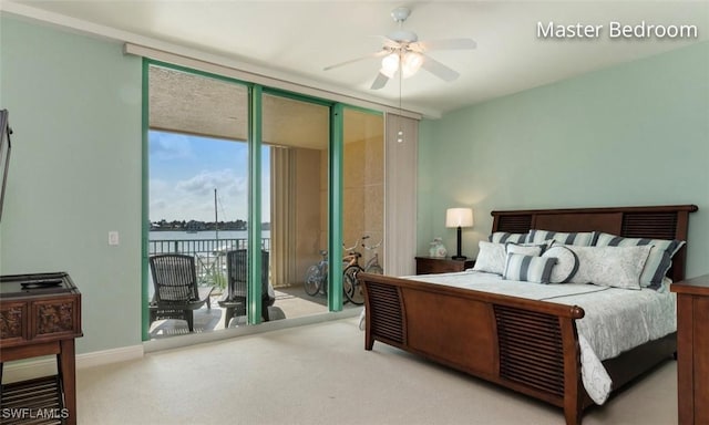 carpeted bedroom with access to exterior, expansive windows, baseboards, and a ceiling fan