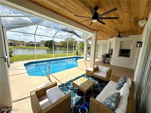 pool with ceiling fan, a patio, outdoor lounge area, a water view, and a grill