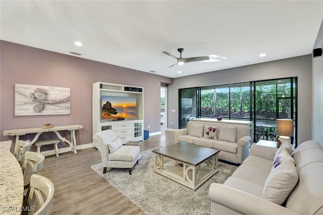 living area with visible vents, wood finished floors, recessed lighting, baseboards, and ceiling fan