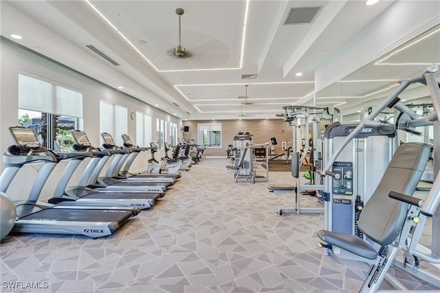 workout area with visible vents, carpet, and a healthy amount of sunlight