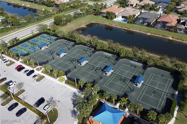 drone / aerial view with a residential view and a water view