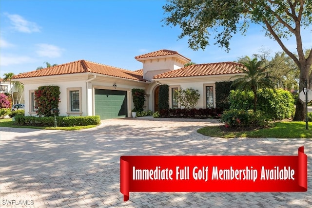 view of front of house with a garage, a tile roof, decorative driveway, and stucco siding