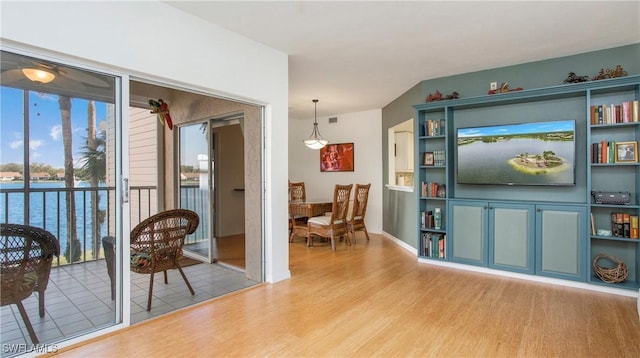 interior space featuring light wood-style floors and visible vents