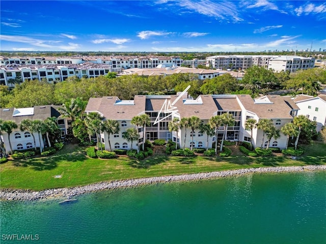 birds eye view of property featuring a water view and a residential view