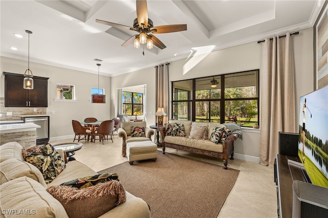 living area featuring a healthy amount of sunlight and ornamental molding